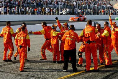 
Kevin Harvick's crew cheers on pit lane after Harvick won Sunday's Nextel Cup race at Loudon, New Hampshire. 
 (Associated Press / The Spokesman-Review)