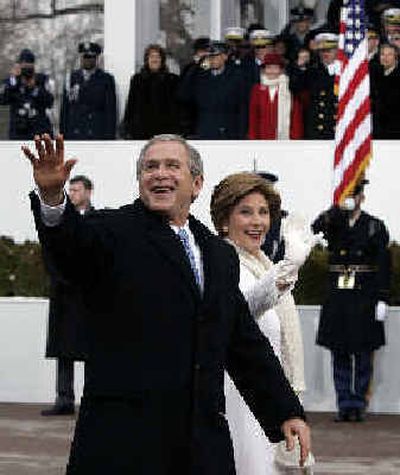 
President Bush waves to the crowd after his inaugural address at the Capitol. 
 (Associated Press / The Spokesman-Review)