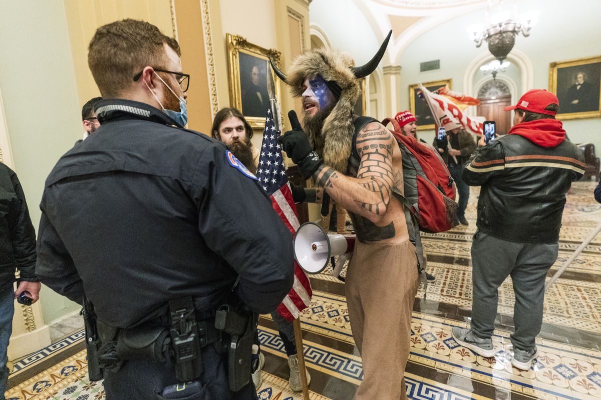 In this Jan. 6, 2021, file photo supporters of President Donald Trump are confronted by U.S. Capitol Police officers outside the Senate Chamber inside the Capitol in Washington.  (Manuel Balce Ceneta/Associated Press)