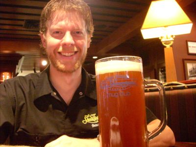 C.I. Shenanigan’s head brewer, Gabe Smoley, sits down with a 22-ounce glassful of his Halloween beer, Frankenweizen, a chocolate dunkel brewed using Bavarian yeast, hinting at flavors of chocolate and banana. (Tom Bowers / The Spokesman-Review)