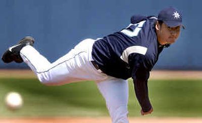 
Mariners starting pitcher Cha Seung Baek throws during Friday's spring training game against the Royals. 
 (Associated Press / The Spokesman-Review)