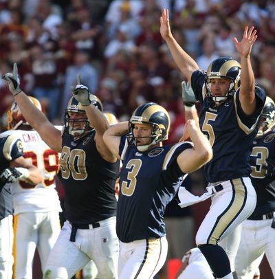 Josh Brown (3) celebrates his game-winning 49-yard field goal with Adam Carriker (90) and Donnie Jones (5).  (Associated Press / The Spokesman-Review)