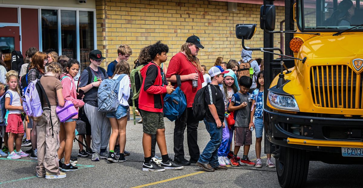 Students form all grades catch the bus after classes Thursday at the Continuous Curriculum School.  (DAN PELLE/THE SPOKESMAN-REVIEW)
