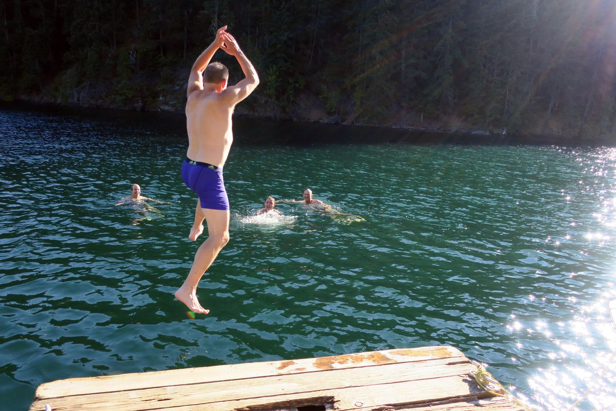 John Stucke jumps into Ross Lake at the Little Beaver Campground on day one of the hike. (John  Nelson / The Spokesman-Review)