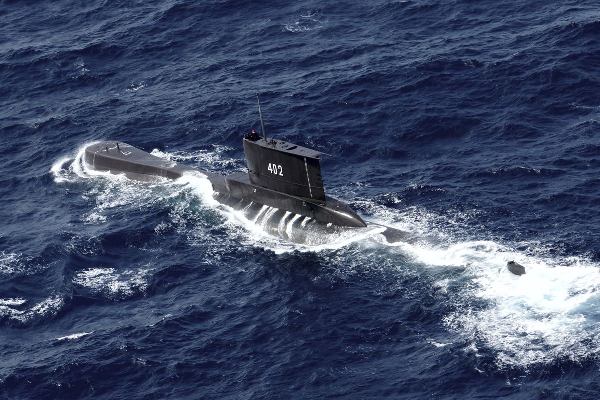 Indonesian Navy submarine KRI Nanggala sails in the waters off Tuban, East Java, Indonesia, as seen in this aerial photo taken from Indonesian Navy helicopter of 400 Air Squadron, in this Monday, Oct. 6, 2014 photo. Indonesia's navy is searching for the submarine that went missing north of the resort island of Bali with a number of people on board, the military said Wednesday.  (STR)