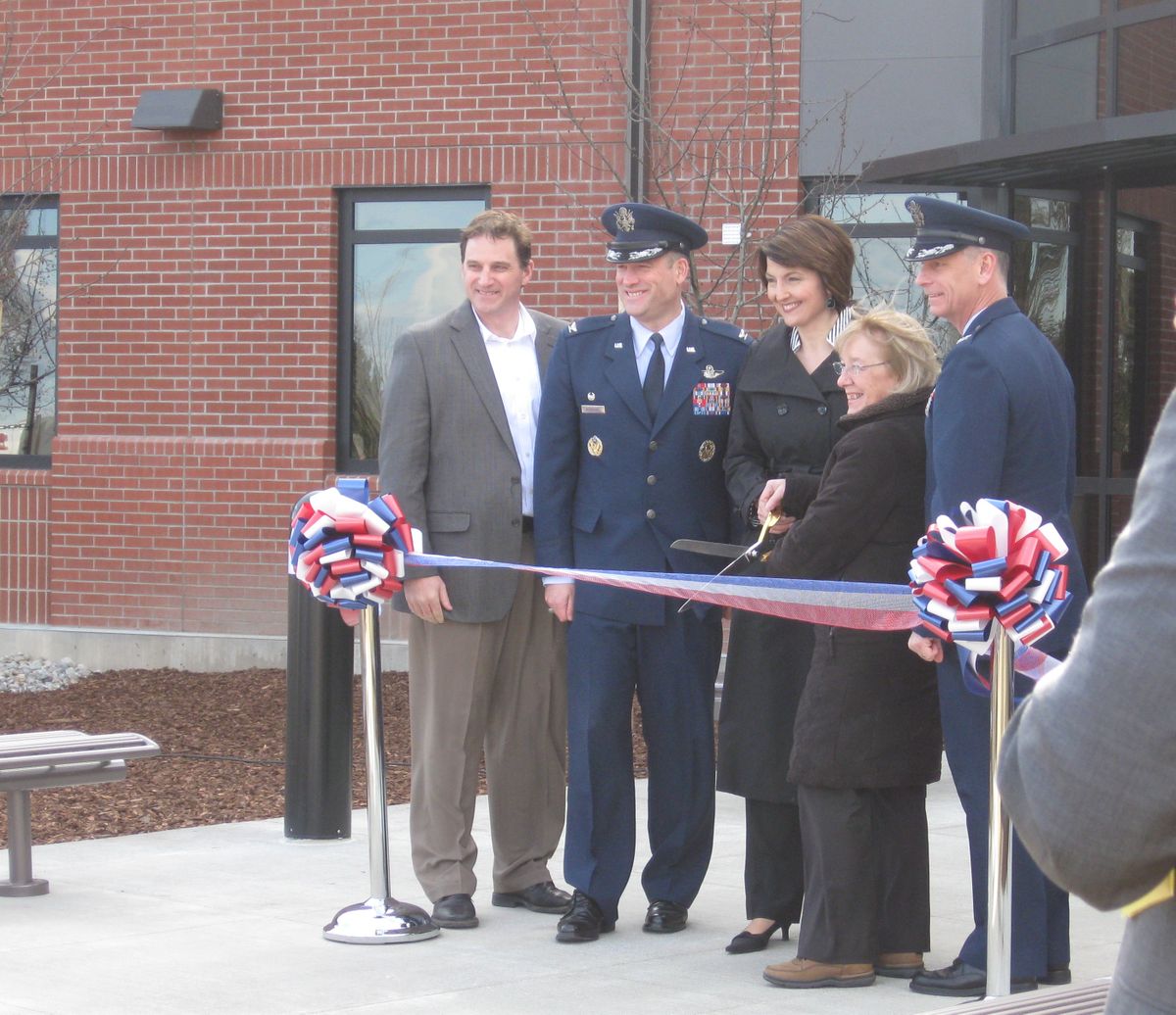 Doug Jackson of Jackson Contractor Group, Col. Brian Newberry, Congresswoman Cathy McMorris-Rodgers, Senator Patty Murray and Col. Daniel Swain cut the ribbon for the new headquarters building at Fairchild Air Force Base.  (Nina Culver)