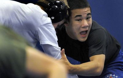Coeur d’Alene High School wrestler Andrew Palmer practices  at the school recently. Palmer, a senior, is a  three-year state qualifier. He took third at state last year, finishing 31-8 overall. (Kathy Plonka / The Spokesman-Review)