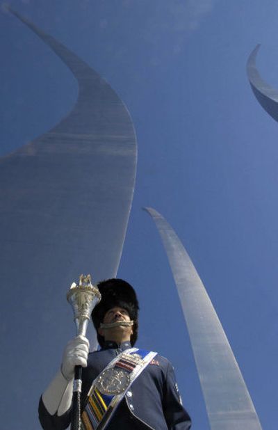 
U.S. Air Force Band member Chief Master Sgt. Ed Teleky stands under the Air Force Memorial at the dedication  on Saturday in Arlington, Va.
 (Associated Press / The Spokesman-Review)