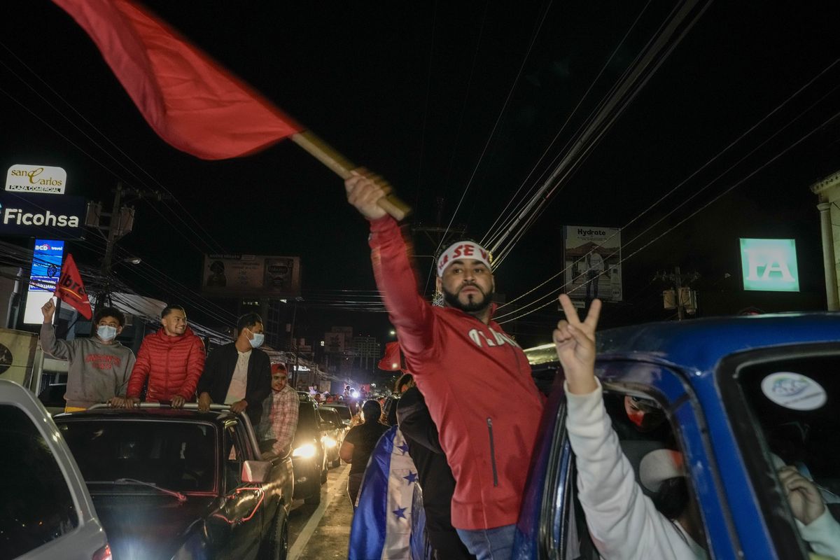 Free Party presidential candidate Xiomara Castro supporters celebrate after general elections, in Tegucigalpa, Honduras, Sunday, Nov. 28, 2021. Castro claimed victory, setting up a showdown with the National Party which said its candidate had won a vote that could end the conservative party