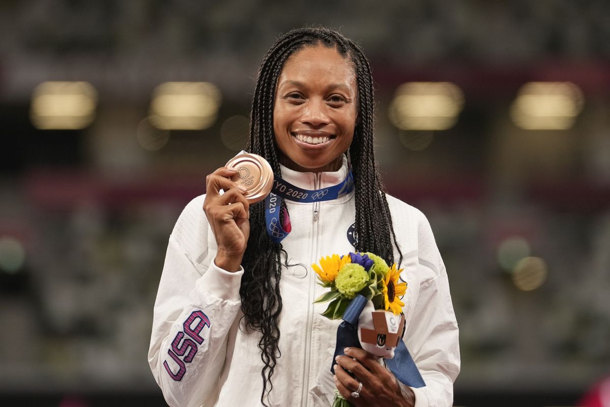 Bronze medalist Allyson Felix, of the United States, poses during the medal ceremony for the women
