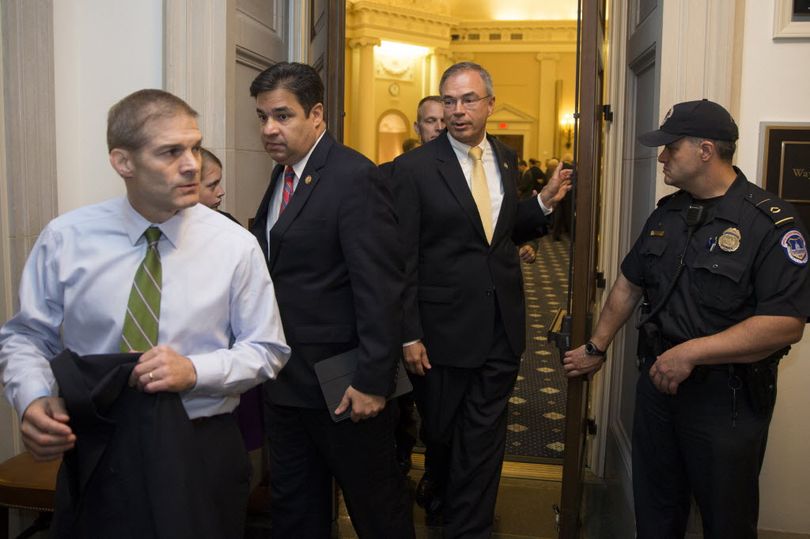 In this AP file photo, Rep. Jim Jordan, R-Ohio, left, followed by Rep. Raul Labrador, R-Idaho, and others, leave a hearing room on Capitol Hill in Washington, Oct. 8, 2015, after a nomination vote to replace House Speaker John Boehner fell apart. Now, Labrador and his Freedom Caucus are in play to name the new House Speaker. (AP Photo/Evan Vucci)