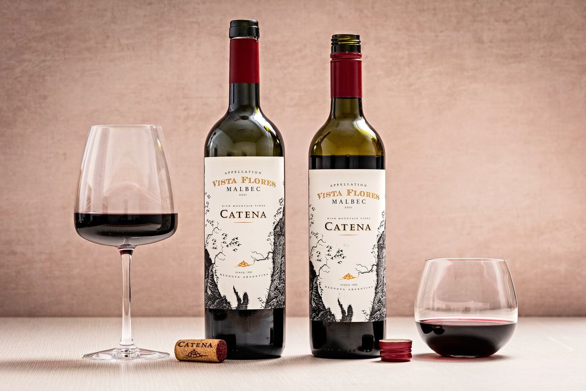 Catena Vista Flores Malbec in the old, heavier bottle (700 grams, left) and new, lighter glass bottle (480 grams, right).  (Scott Suchman/For the Washington Post)