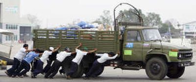 
A truckload of supplies is pushed at the Yangon airport Saturday.
 (The Spokesman-Review)