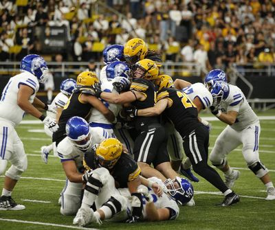 The Idaho Vandals' defense swarms a Drake Bulldogs player during a 42-14 win in the Kibbie Dome on Saturday, Sept. 17, 2022.  (Courtesy Idaho Athletics)