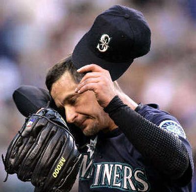 
Jamie Moyer worked up a sweat in losing to the Rockies.
 (Associated Press / The Spokesman-Review)