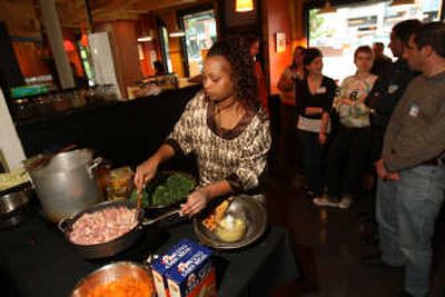 
Susan Njeri cooks Kenyan food for a group called the World Affairs Council at Pan Africa Market in Seattle earlier this month, part of the council's Culture Through Cuisine series that aims to increase understanding of other cultures. Associated Press
 (Associated Press / The Spokesman-Review)
