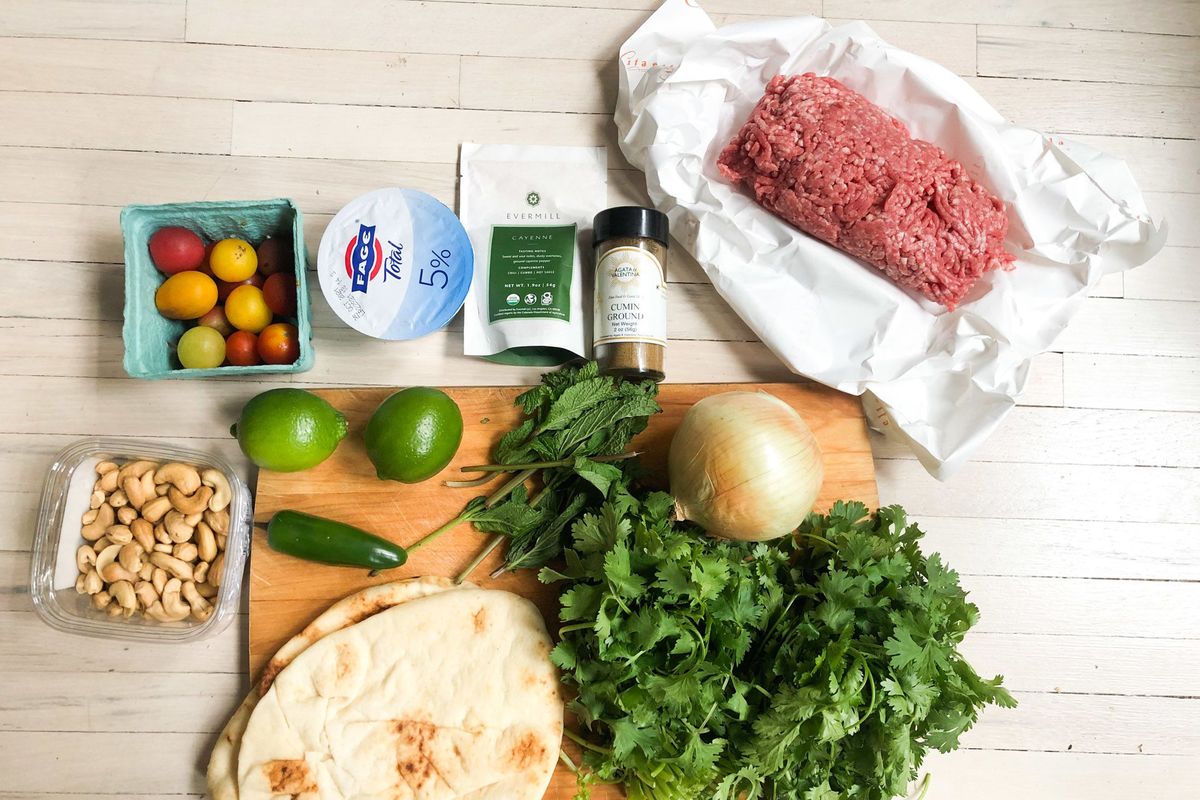 The makings for lamb burgers with cilantro chutney herald a change of seasons.  (Kate Krader/Bloomberg)