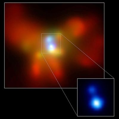 This Chandra X-ray image clearly reveals two supermassive black holes in the core of NGC 6240, the Starfish Galaxy.  (HANDOUT)