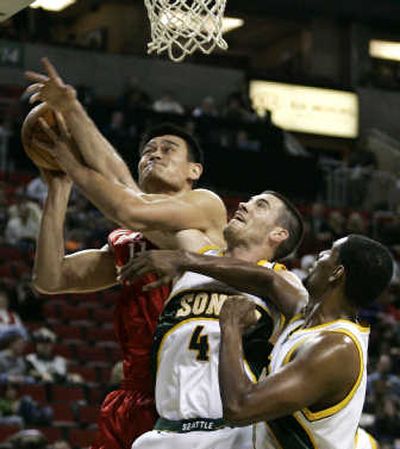 
Yao Ming and the Rockets beat Seattle 117-94 Saturday at Seattle.Associated Press
 (Associated Press / The Spokesman-Review)