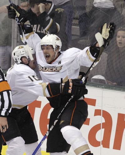 Anaheim Ducks veteran Teemu Selanne, right, rejoices after notching the game-tying goal to force overtime with Dallas. (Associated Press)