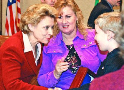
After signing into law a ban on disruptive protests within 500 feet of funerals, Gov. Chris Gregoire, left, met Friday with family members who've lost loved ones serving in Iraq, including Adam LaBouff, right, and  his mother, Teresa LaBouff, both of Olympia. Teresa LaBouff's brother was killed in Iraq a year ago. 
 (RICHARD ROESLER / The Spokesman-Review)