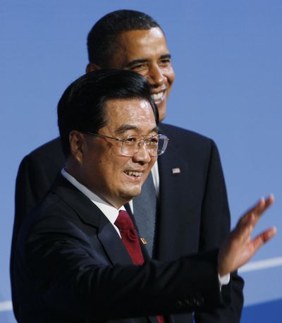 President Barack Obama welcomes China’s President Hu Jintao at the G-20 summit dinner in Pittsburgh on Sept. 24, 2009.  (Associated Press)