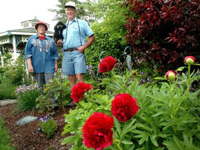
Terry and Charlie Klement in their award-winning garden, which has been their passion since 1996.  
 (The Spokesman-Review)