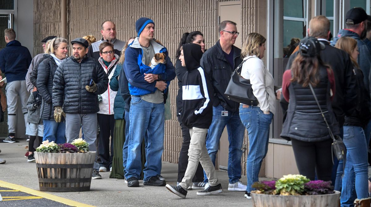 Parents form a line outside Eastpoint Church in Spokane Valley to pick up their children who were evacuated from Central Valley High School because of a threat discovered on a restroom wall on Friday, Nov. 22, 2019. (Dan Pelle / The Spokesman-Review)