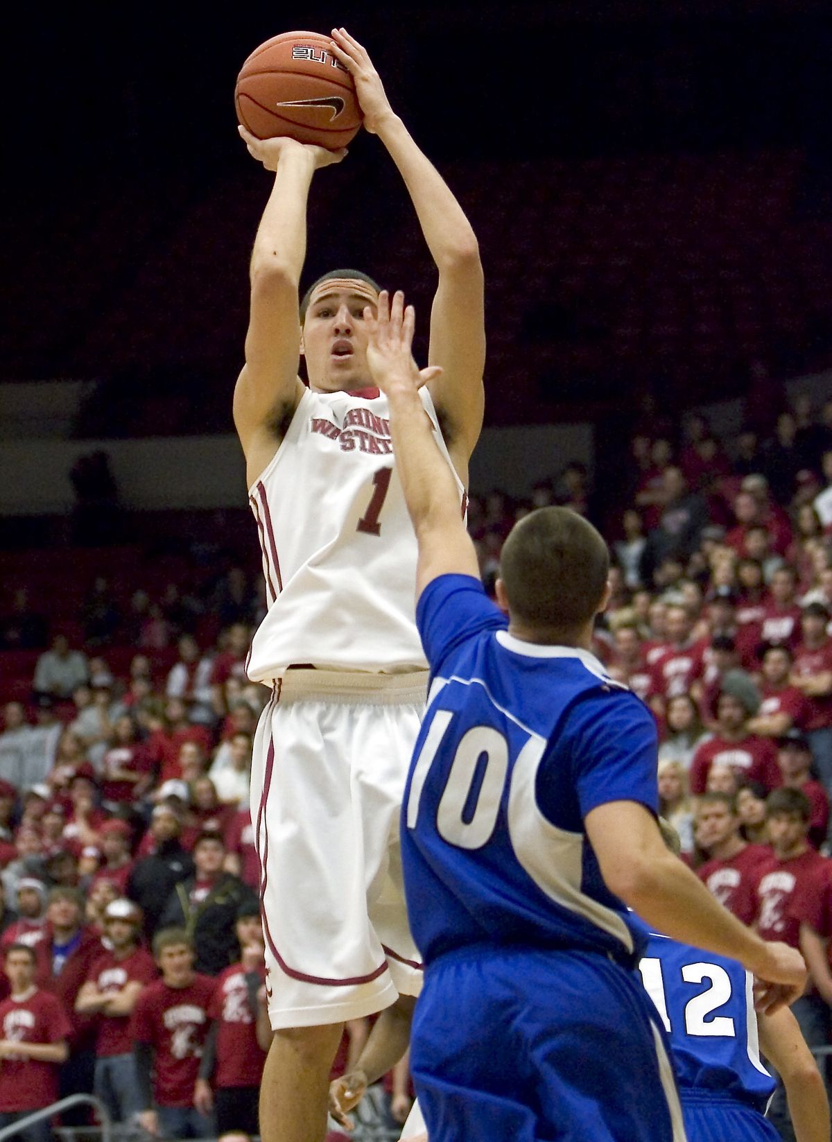 Washington State guard Klay Thompson (1) hits a 3-point shot over the defense of IPFW guard Zach Plackemeier (10) during the first half of an NCAA college basketball game Thursday, Nov. 19, 2009, at Beasley Coliseum in Pullman, Wash. (Dean Hare / Associated Press)