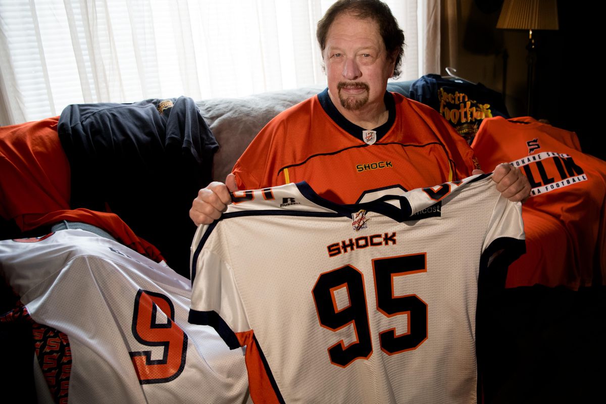 Shock superfan Mike Ellis poses for a photo with some of the Shock memorabilia he has collected on Tuesday, June 19, 2018, at his home in Spokane, Wash. (Tyler Tjomsland / The Spokesman-Review)