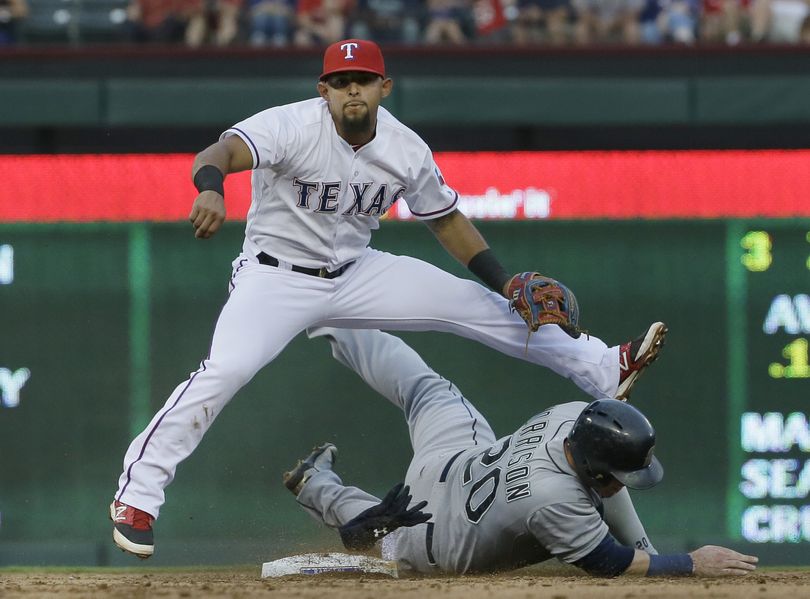 Seattle Mariners Logan Morrison, right, slides into second base trying the break up the double play against Texas Rangers second baseman Rougned Odor, left, during the second inning of a baseball game in Arlington, Texas, Monday. Mariners Mike Zunino was out at first.  (Associated Press)