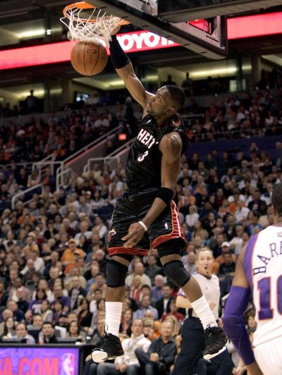 Miami Heat guard Dwyane Wade lit up the Suns for 43 points.  (Associated Press / The Spokesman-Review)
