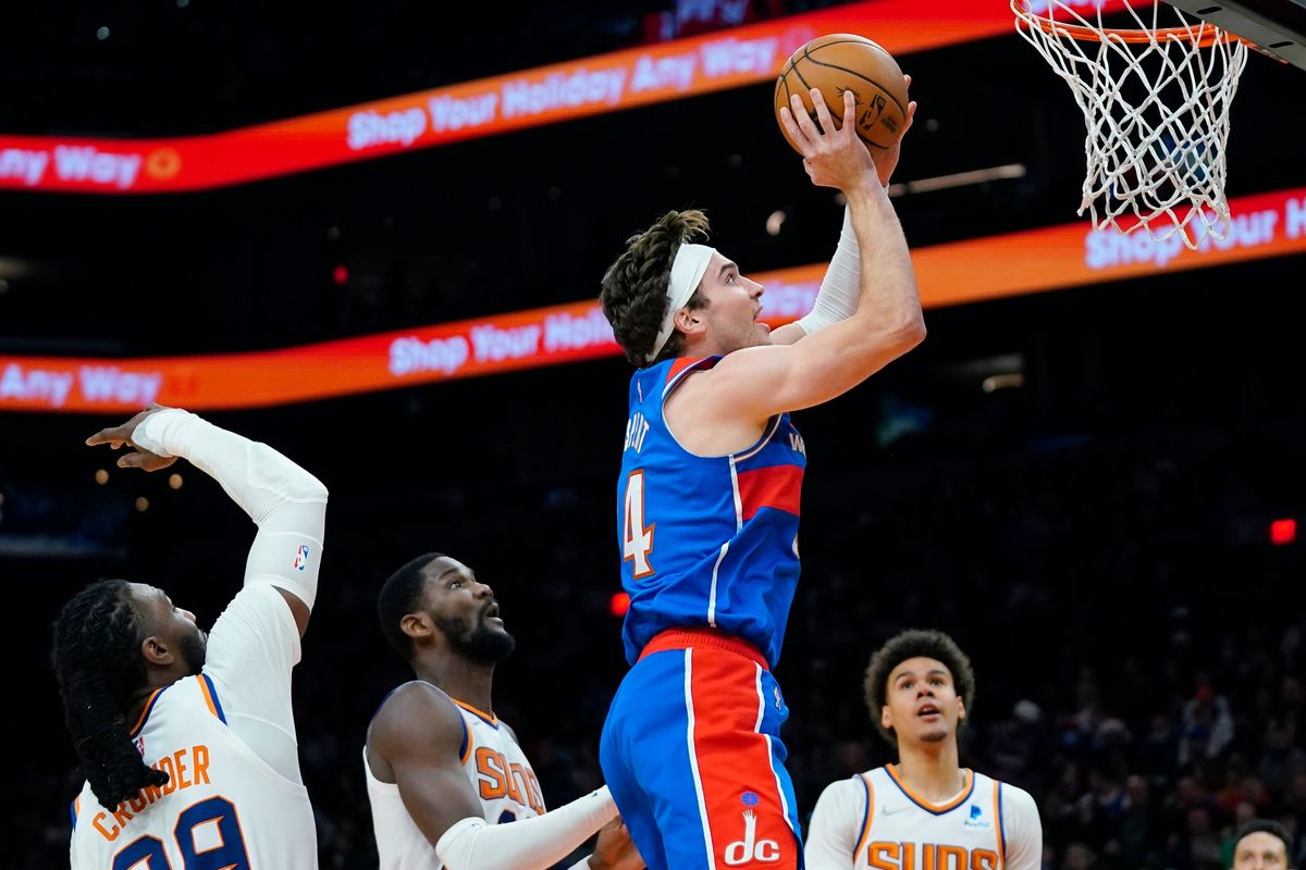 Wizards forward Corey Kispert drives past Phoenix’s defense during the first half of Thursday’s NBA game in Phoenix.  (Associated Press)