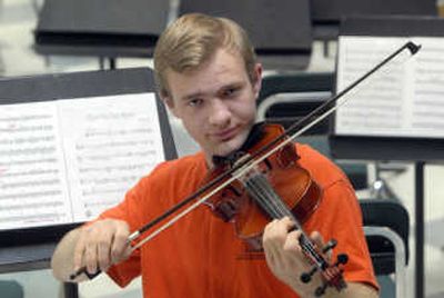 
EV senior Anthony Vanduzee  plays violin in the school orchestra and piano for the school's Strolling Strings. He participates in theater, and directed a play he wrote. 
 (J. BART RAYNIAK / The Spokesman-Review)