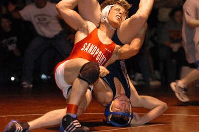
Sandpoint's Joey Fio, the 125-pound winner at last year's meet, tries to reverse Auburn-Riverside's Michael Mangrum in the final moments of the title match. Mangrum won 5-4. 
 (Jesse Tinsley / The Spokesman-Review)
