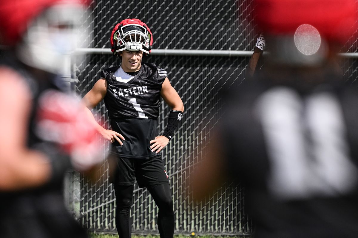 Eastern Washington cornerback Cage Schenck watches from the sidelines during the Eagles’ first day of fall football camp Tuesday in Cheney.  (Tyler Tjomsland/The Spokesman-Review)