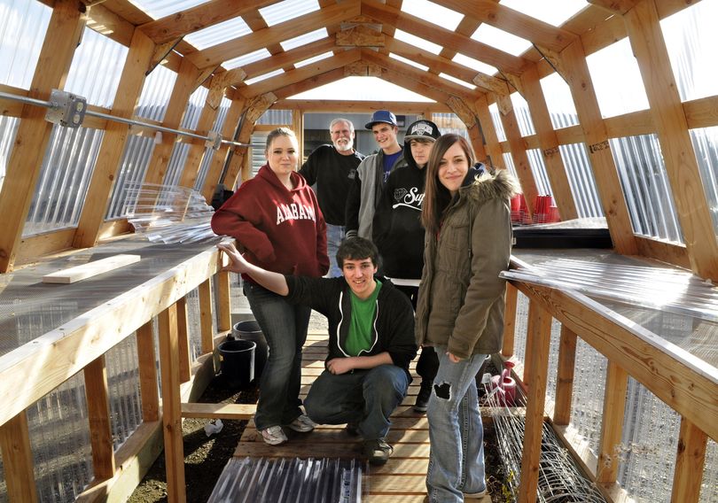 Teacher Robbie Robinson, second from left, stands in a greenhouse with Harmony High School students, from left, Satieva Ankley, Josh Armstrong, Chris Kinyon, Cody Buchanan and Franki Turner. (Dan Pelle)