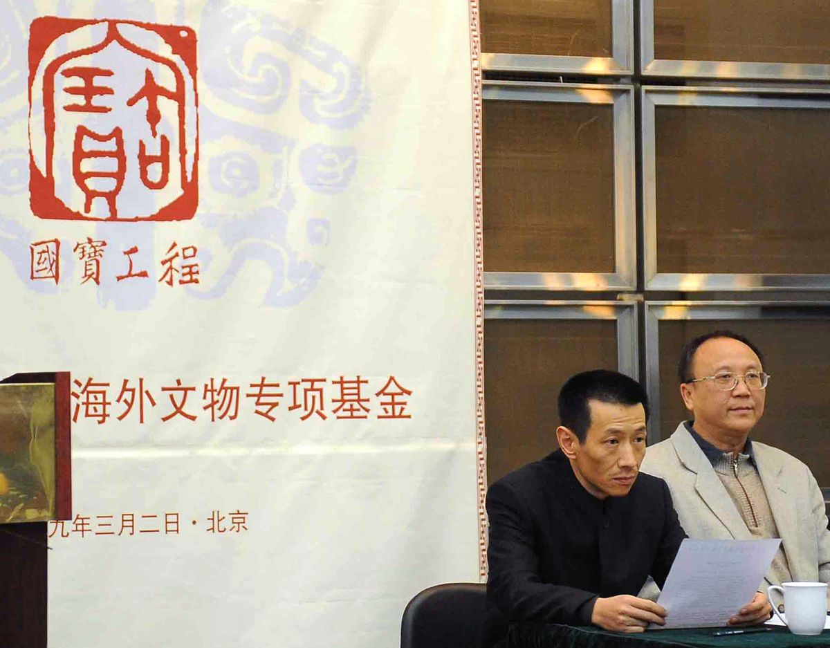 In this photo released by China’s Xinhua News Agency, Cai Mingchao, left, a collection adviser of National Treasures Fund who successfully bid for looted bronze sculptures in Paris last week, attends a news conference in Beijing on Monday.Associated Press photos (Associated Press photos / The Spokesman-Review)