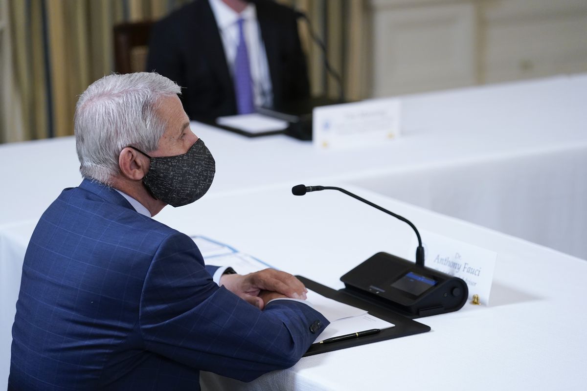 Dr. Anthony Fauci, director of the National Institute of Allergy and Infectious Diseases, listens as President Joe Biden receives a briefing in the State Dining Room of the White House in Washington, Tuesday, Aug. 10, 2021, on how the COVID-19 pandemic is impacting hurricane preparedness. (Susan Walsh)