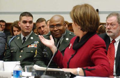 
Louisiana Gov. Kathleen Blanco, testifying Wednesday on Capitol Hill,  gestures toward Sgt. Corey Allbritton, left, and Staff Sgt. Norman Norfleeet of the Louisiana National Guard. Both men were serving in Iraq and lost their New Orleans homes in Hurricane Katrina.
 (Associated Press / The Spokesman-Review)