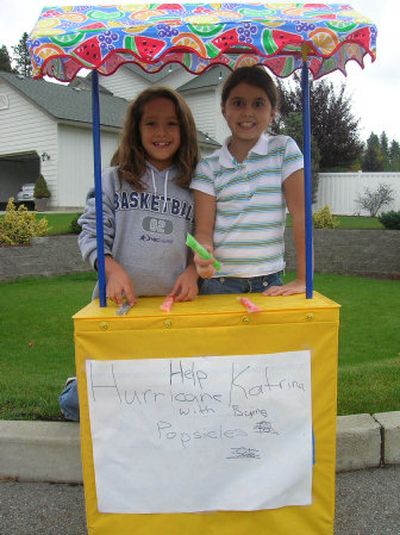 
Anna Lee, left, and Molly Tabish of Adams Elementary sold popsicles Sept. 25 to raise money to help victims of Hurricane Katrina. 
 (Courtesy of Laura Tabish / The Spokesman-Review)