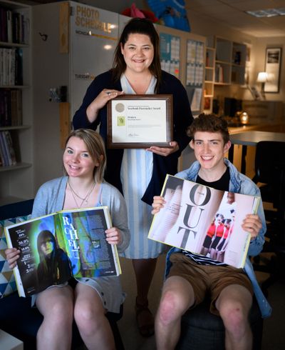 The Mead High School yearbook staff was named a Pacemaker Finalist by the National Scholastic Press Association. Pictured is yearbook adviser Makena Busch (behind), student and Editor-in-Chief Isabella Wood, 18, and Photo Editor Daniel Jarvis, 18. (Colin Mulvany / The Spokesman-Review)