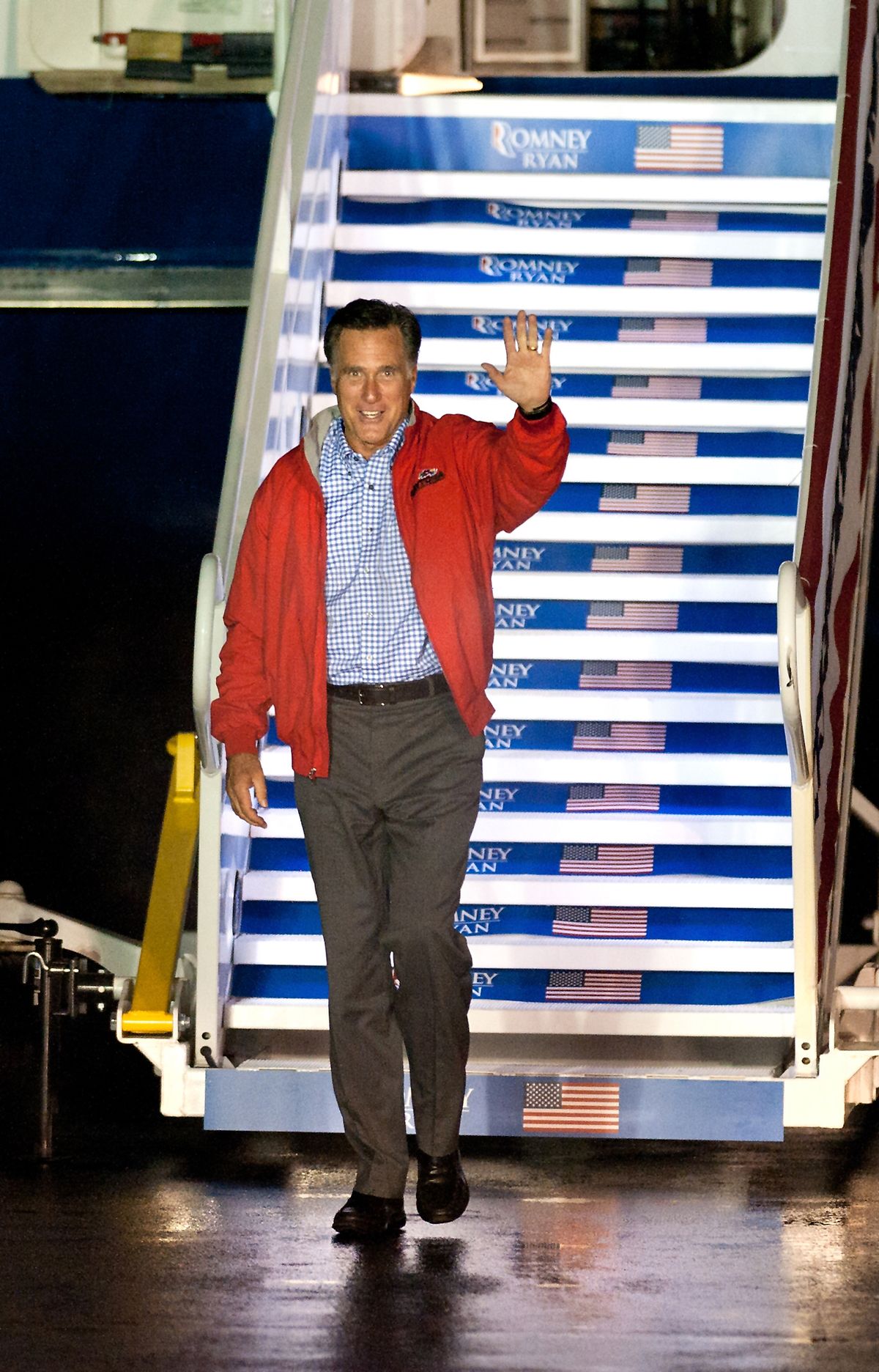 Republican presidential candidate, former Massachusetts Gov. Mitt Romney, waves towards a camera platform after exiting his MD-83 campaign plane at the Shenandoah Valley Regional Airport Sunday evening Oct. 7, 2012 in Weyers Cave, Va. Romney completed a three day campaign swing through Florida and will deliver a foreign policy address at the Virginia Military Institute in Lexington Monday. (Michael Reilly / Daily News-record)