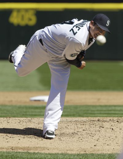 Seattle’s Felix Hernandez throws the final pitch in the 23rd perfect game in major league history. (Associated Press)