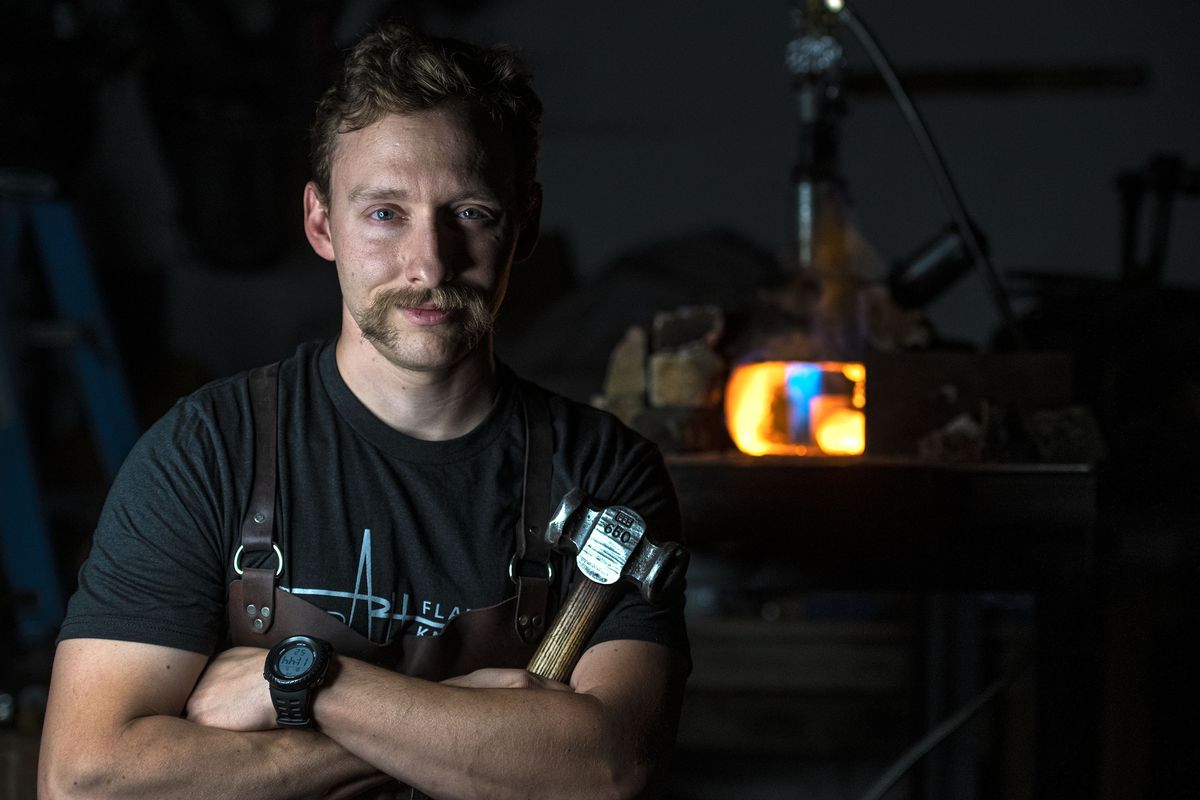Spokane firefighter Andrew Hall of Coeur d’Alene recently won on the show “Forged in Fire,” he is photographed at his shop.  (Kathy Plonka/The Spokesman-Review)