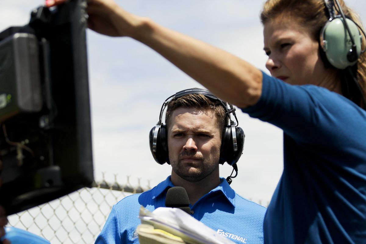 Driver Ricky Stenhouse Jr., left, and broadcast pit reporter Jamie Little look over a monitor during the NASCAR xfinity Series auto race, Saturday, June 10, 2017, in Long Pond, Pa. (Matt Slocum / Associated Press)