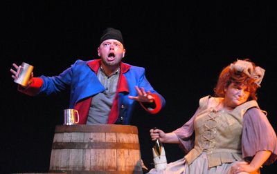 Roger Welch and Leslie Rhodes play Monsieur and Madame Thenardier in “Les Miserables.” (Jesse Tinsley / The Spokesman-Review)