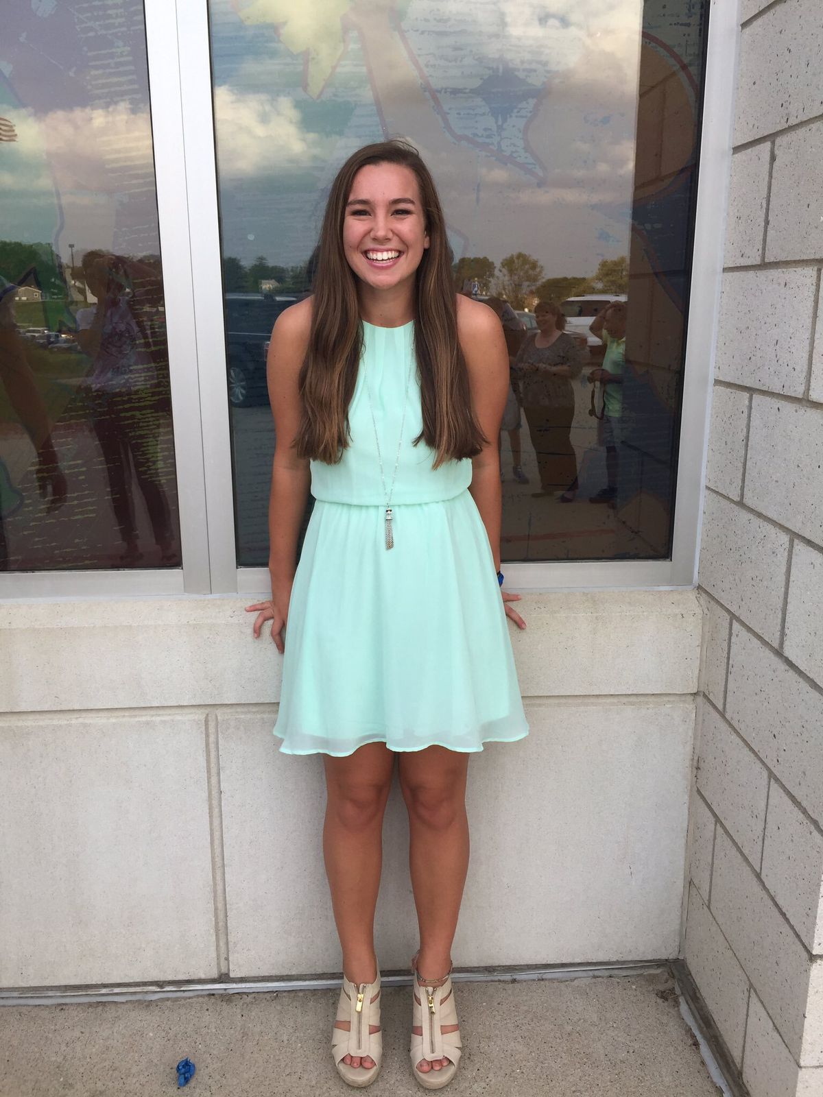 In this September 2016 photo provided by Kim Calderwood, Mollie Tibbetts poses for a picture during homecoming festivities at BGM High School in her hometown of Brooklyn, Iowa. Cristhian Bahena Rivera, the man charged with killing Tibbetts while she was out for a run in July 2018, will stand trial for first-degree murder on Monday, May 17, 2021, in Davenport, Iowa.  (Kim Calderwood)