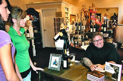 
Craig Renaud signs books at Spokane's Davenport Hotel. 
 (Photo courtesy of Craig Renaud / The Spokesman-Review)
