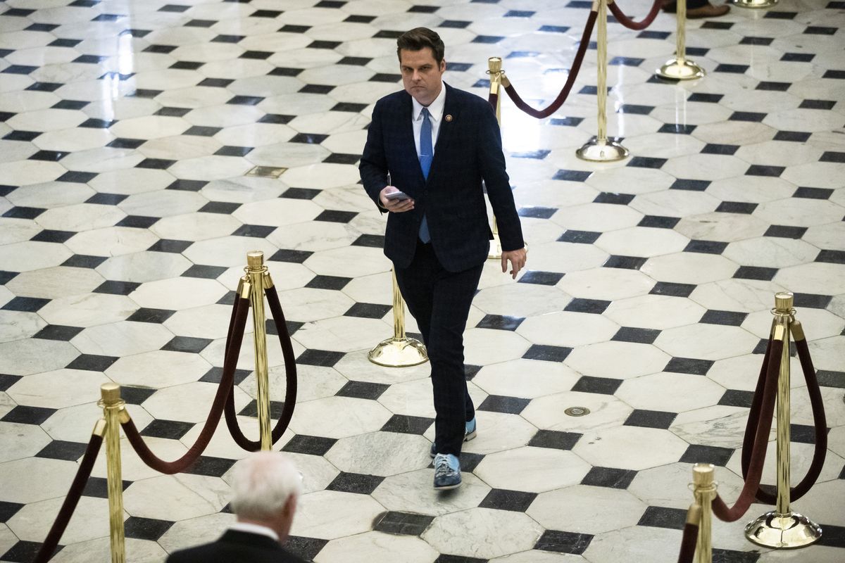 FILE - In this Dec. 18, 2019, file photo Rep. Matt Gaetz, R-Fla., walks off the House floor as House of Representatives takes up articles of impeachment against President Donald Trump on Capitol Hill in Washington. (Matt Rourke)
